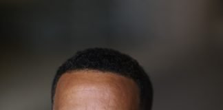 Africans in diaspora: Global Home of Foreign Experts Black man on suit